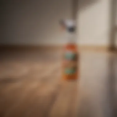 Vinegar and Cleaner for Laminate Floors A bottle of vinegar and a spray cleaner on laminate flooring