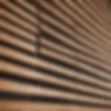 A close-up view of a wooden blind with dust accumulation