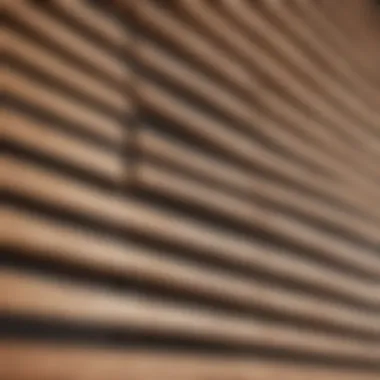 A close-up view of a wooden blind with dust accumulation