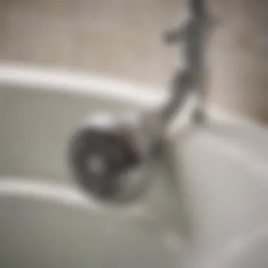 Close-up of a bathtub drain with a visual of a clog.