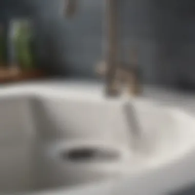 Close-up of a sink drain with a plunger in action