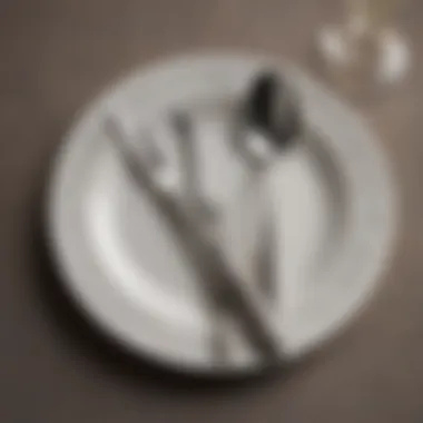 Close-up of intricately designed flatware against a luxurious tablecloth