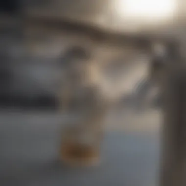 Close-up of vinegar being poured into coffee pot